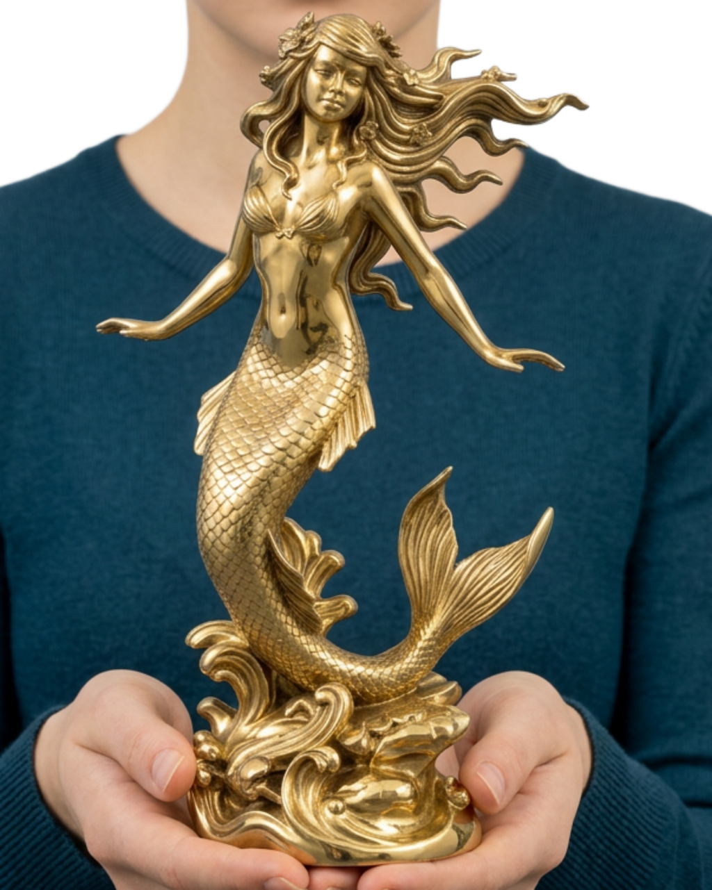 Polished Brass Mermaid Sculpture by MokshaGoldSculptures with flowing hair and fish tail, held by person in teal sweater.