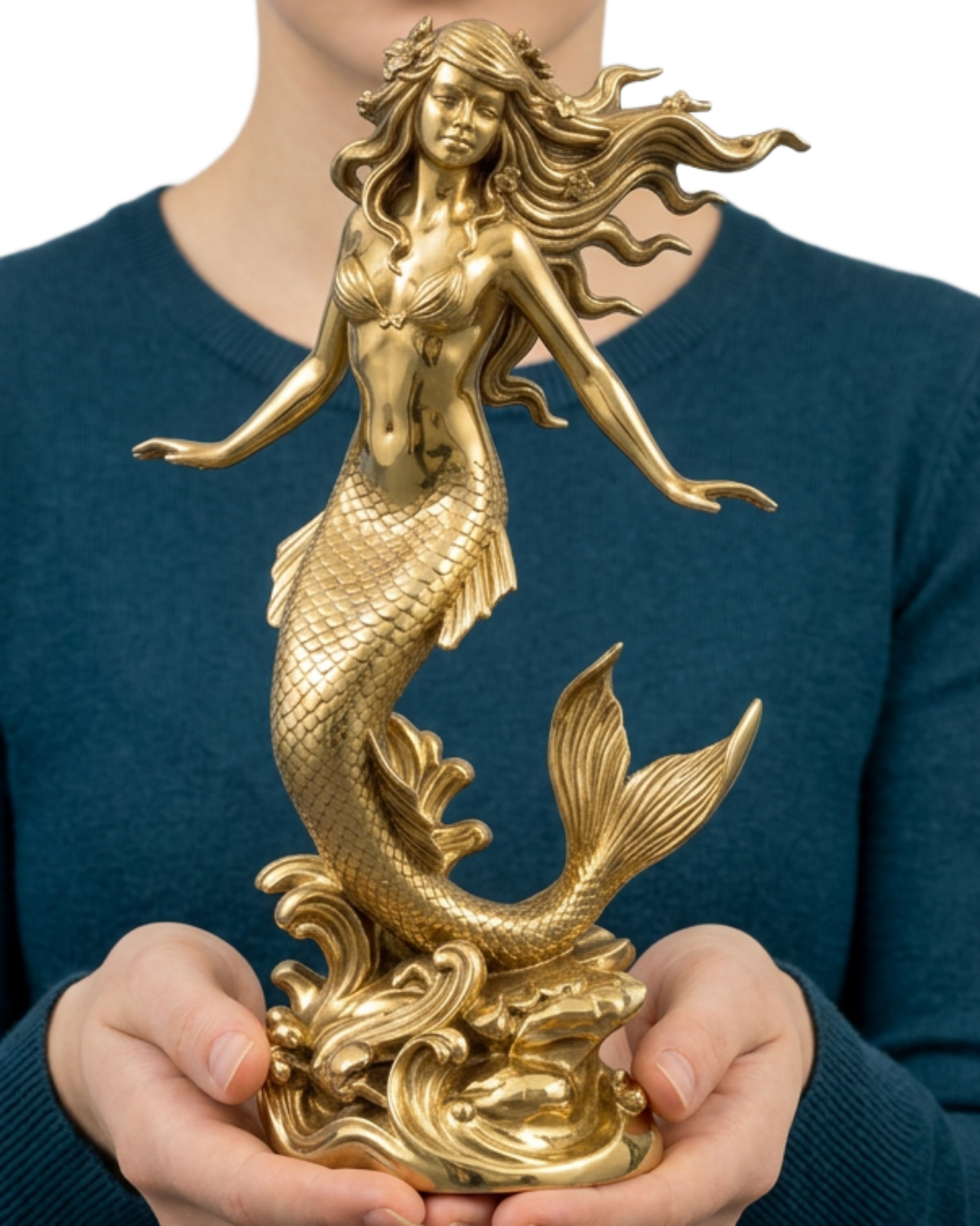 Polished Brass Mermaid Sculpture by MokshaGoldSculptures with flowing hair and fish tail, held by person in teal sweater.