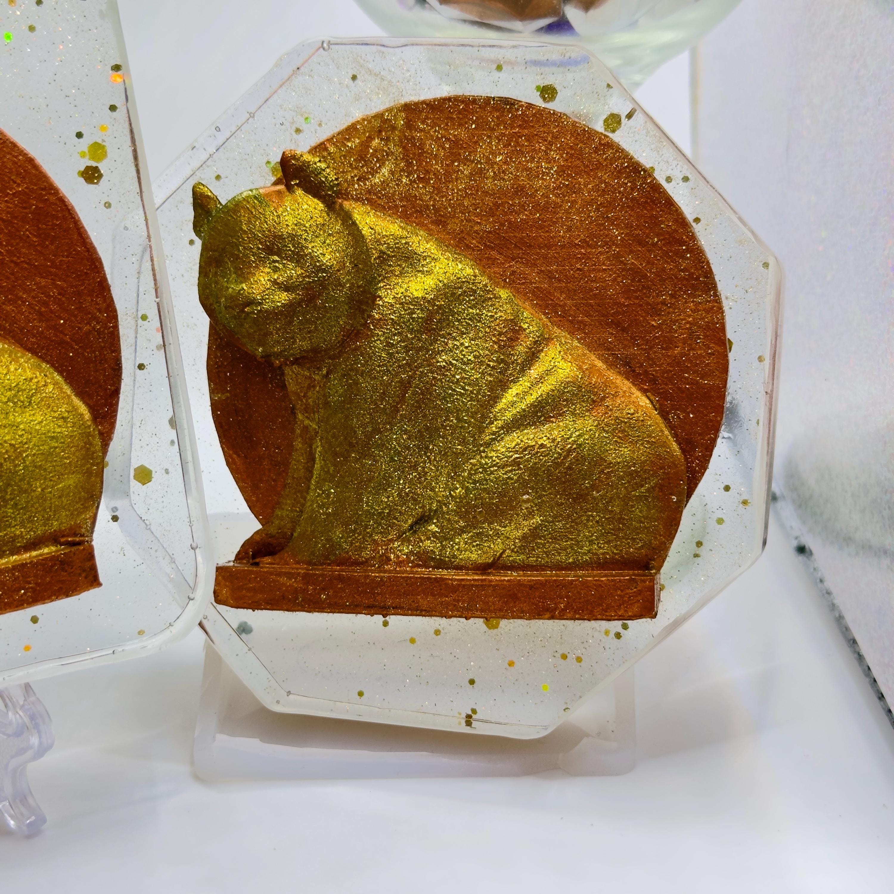 The Handmade Panda Resin Coaster in clear resin by MokshaGoldSculptures, black and white art on display stand.