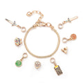 Legend of Zelda Charm Bracelet in silver-tone by MokshaGoldSculptures with eight Breath of the Wild charms including sword and shield.