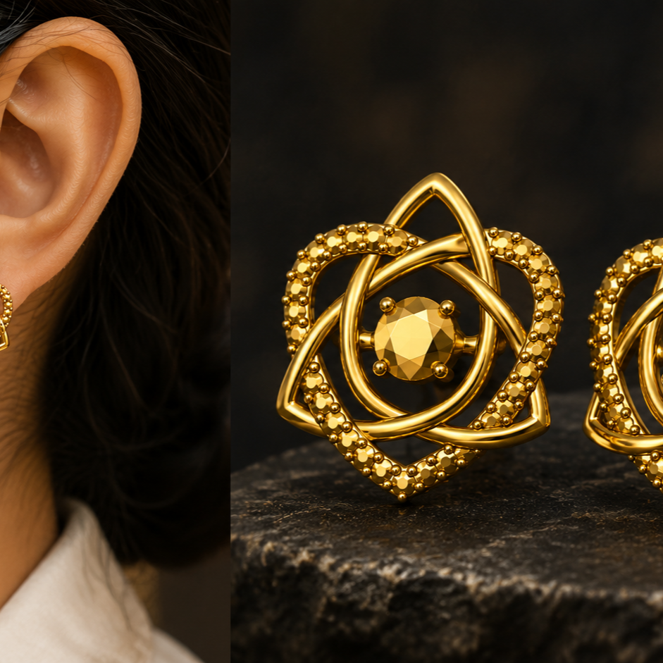 Celtic Trinity Knot Heart Stud Earrings in 9K gold by MokshaGoldSculptures, worn and shown on dark stone.