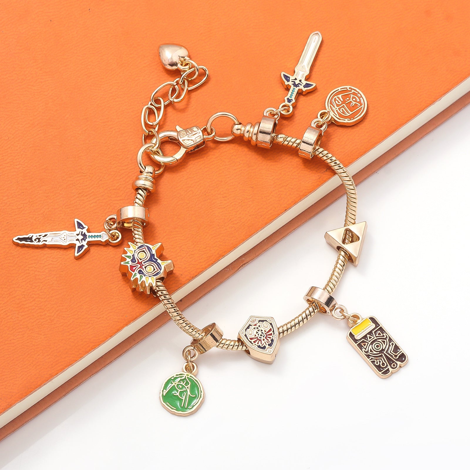 Legend of Zelda Charm Bracelet – Breath of the Wild in silver finish by MokshaGoldSculptures with seven themed charms.
