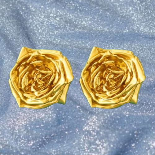 Rose Stud Earrings in gold finish (14mm) by MokshaGoldSculptures displayed on glittery blue fabric background.