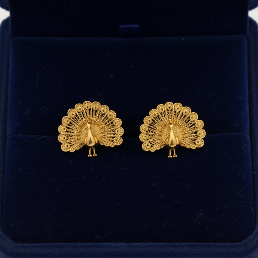 Peacock Stud Earrings in 9K gold fan tail design by MokshaGoldSculptures, shown in dark blue velvet box.