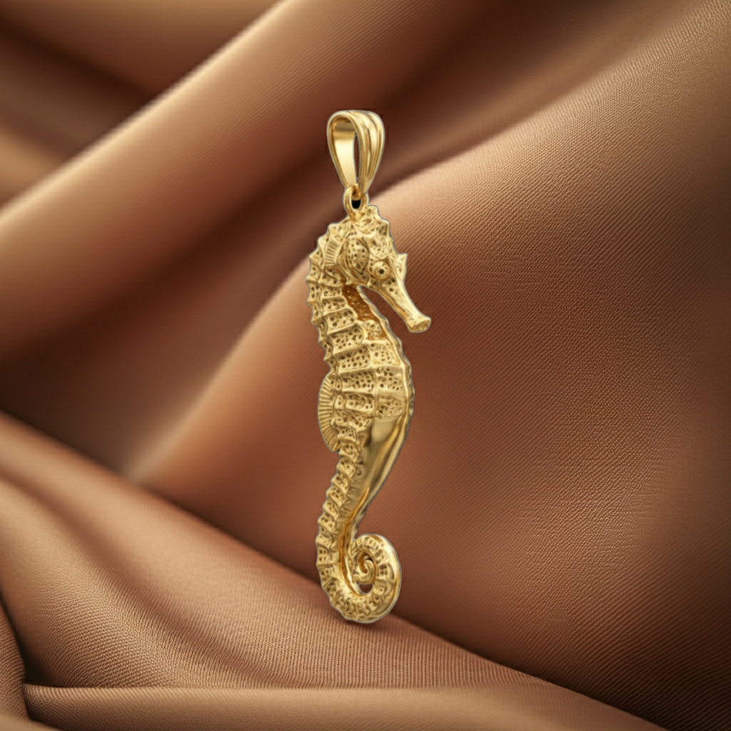 Seahorse Pendant Necklace in gold tone by MokshaGoldSculptures, ocean-inspired on light brown satin.