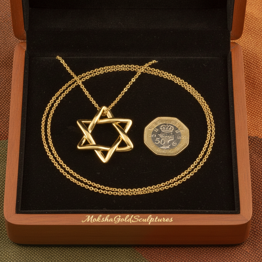 The Interlaced Star of David Pendant Necklace in 18K gold by MokshaGoldSculptures, shown on chain in wooden box.