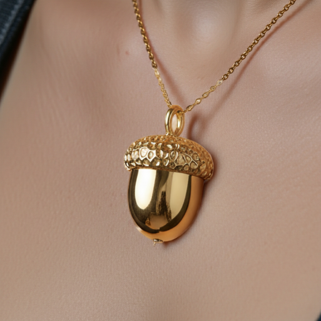 Gold Acorn Pendant Necklace in 24K gold plate by MokshaGoldSculptures, shown on a delicate chain around the neck.