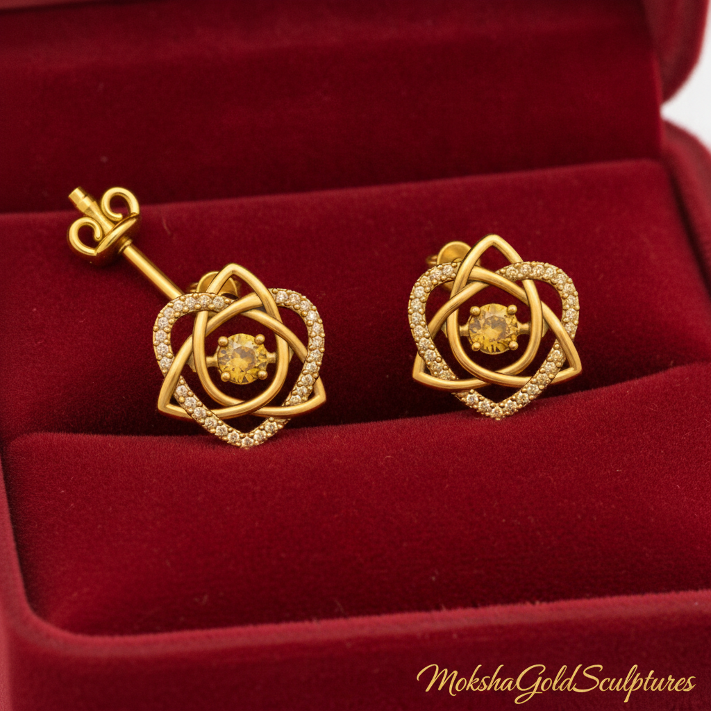Celtic Trinity Knot Heart Stud Earrings in 9K gold, silver, or brass with floral details by MokshaGoldSculptures.
