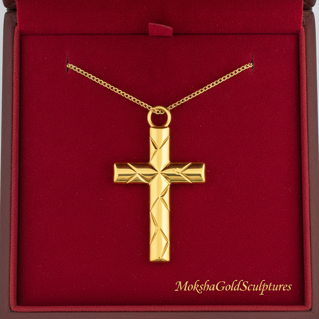 Faceted Cross Pendant Necklace in 9K gold by MokshaGoldSculptures, geometric finish, shown in red velvet branded box.