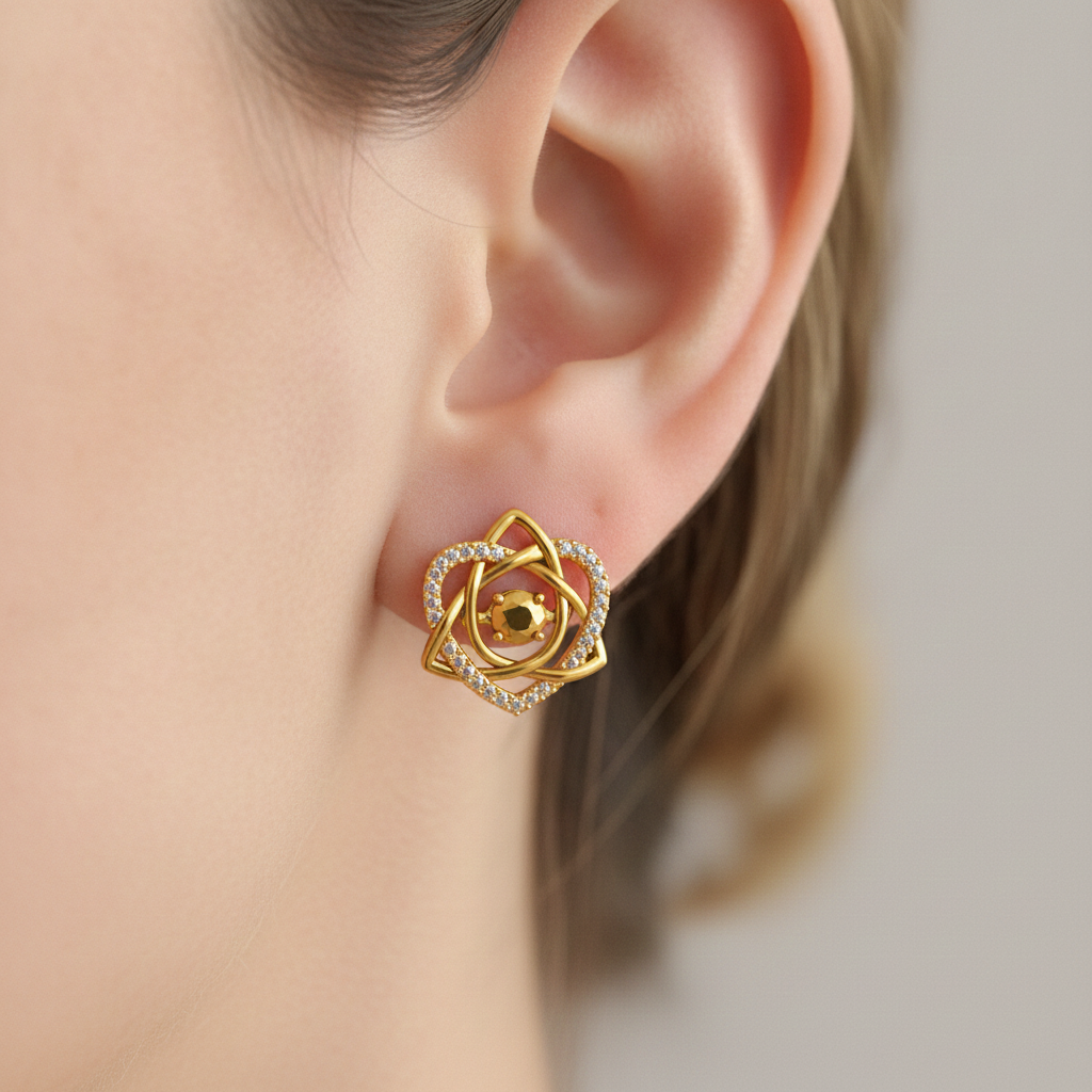 Celtic Trinity Knot Heart Stud Earring in 9K gold by MokshaGoldSculptures worn on ear, intricate Irish-inspired design.