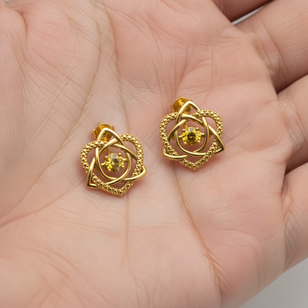 Celtic Trinity Knot Heart Stud Earrings in 9K gold by MokshaGoldSculptures, featuring intricate Irish knot design.