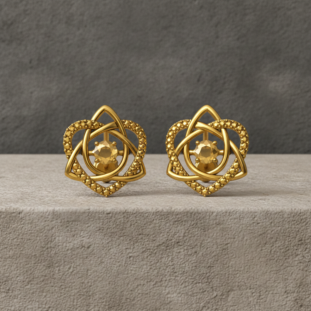 The Celtic Trinity Knot Heart Stud Earrings in 9K gold by MokshaGoldSculptures on a neutral textured surface.