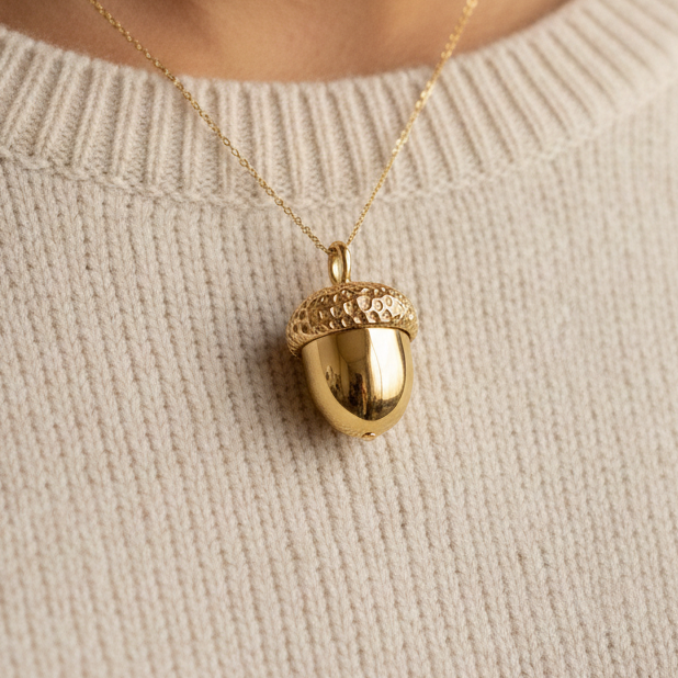 The Gold Acorn Pendant Necklace in 24K gold plated finish by MokshaGoldSculptures on a delicate chain.