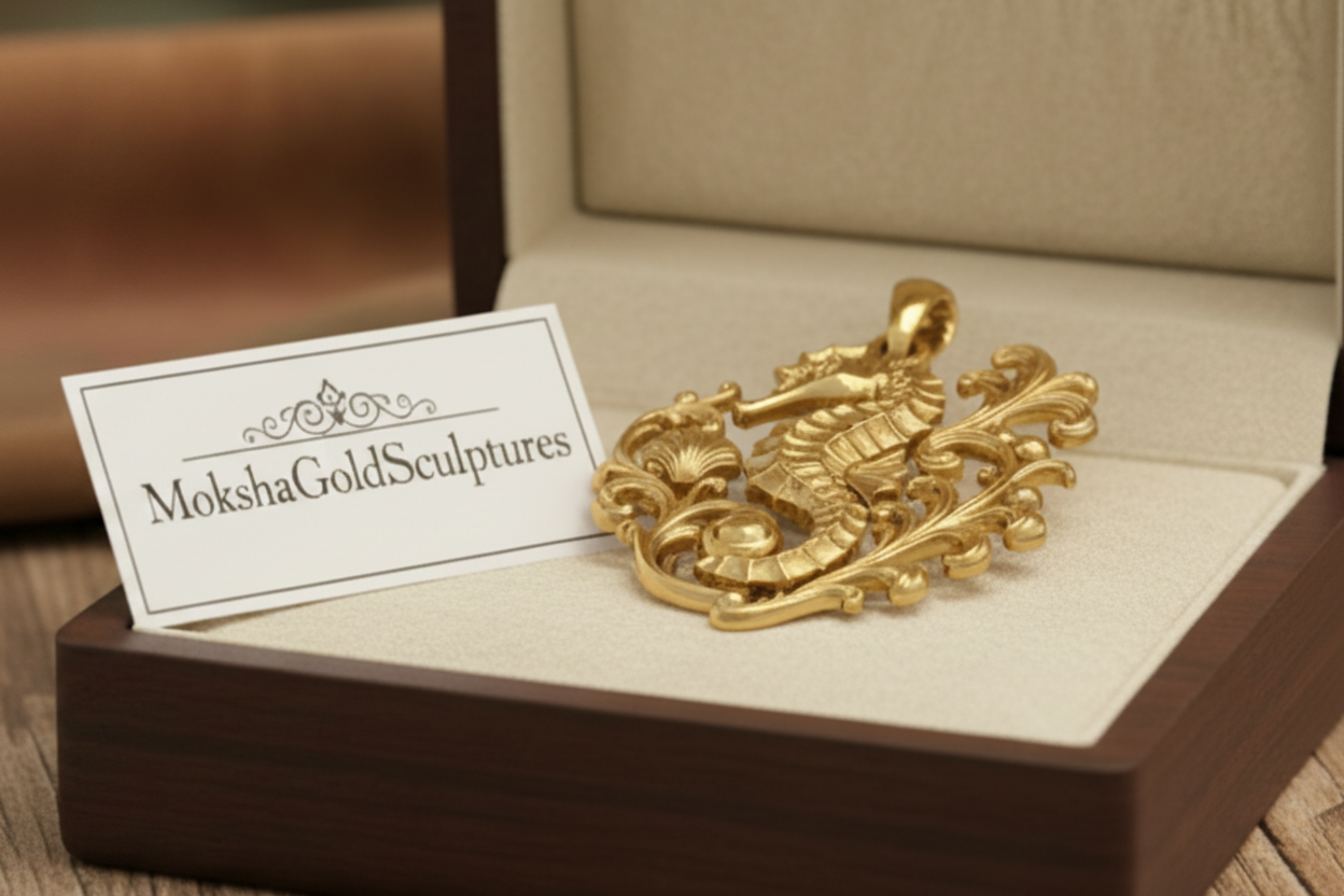 The Seahorse Pendant Necklace in gold by MokshaGoldSculptures, ornate ocean design, displayed in open box.