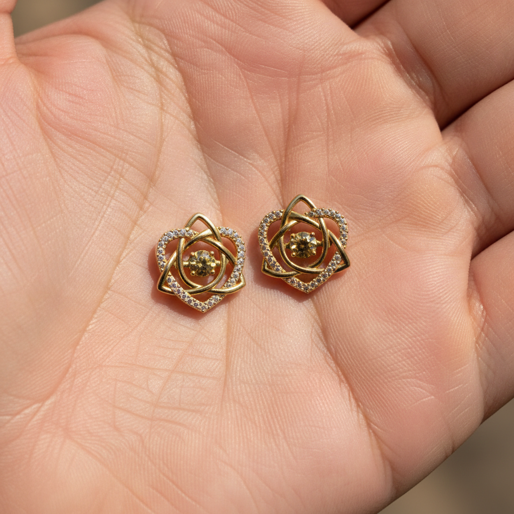 Celtic Trinity Knot Heart Stud Earrings in 9K gold and sterling silver by MokshaGoldSculptures.