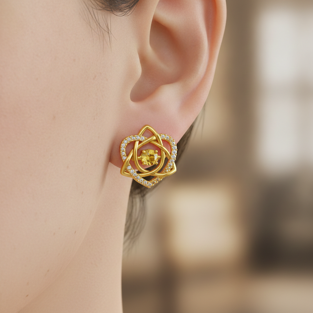 Celtic Trinity Knot Heart Stud Earrings in gold by MokshaGoldSculptures, with sparkling center and diamond-accented petals.