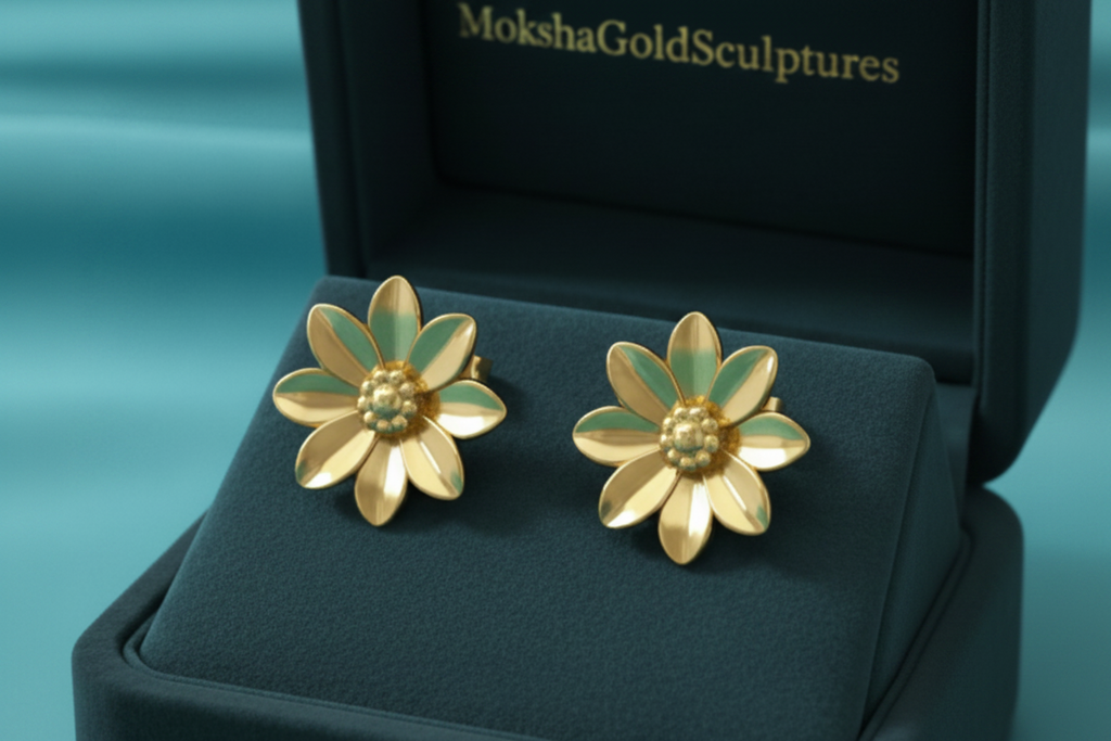 Flower stud earrings in polished brass by MokshaGoldSculptures, botanical detailing, displayed in a dark green box.