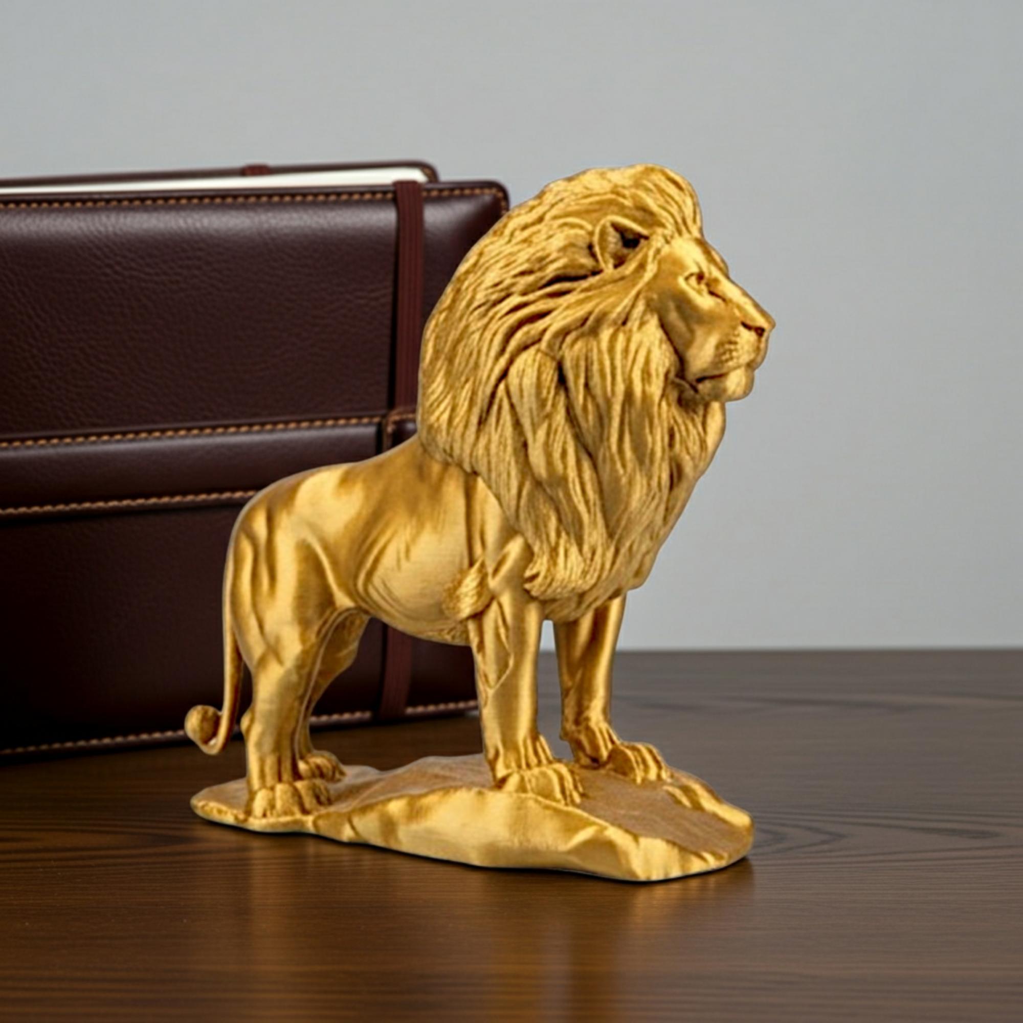 The Gold Lion Statue on Rock, metallic PLA finish by MokshaGoldSculptures, 3D printed sculpture on wood surface.