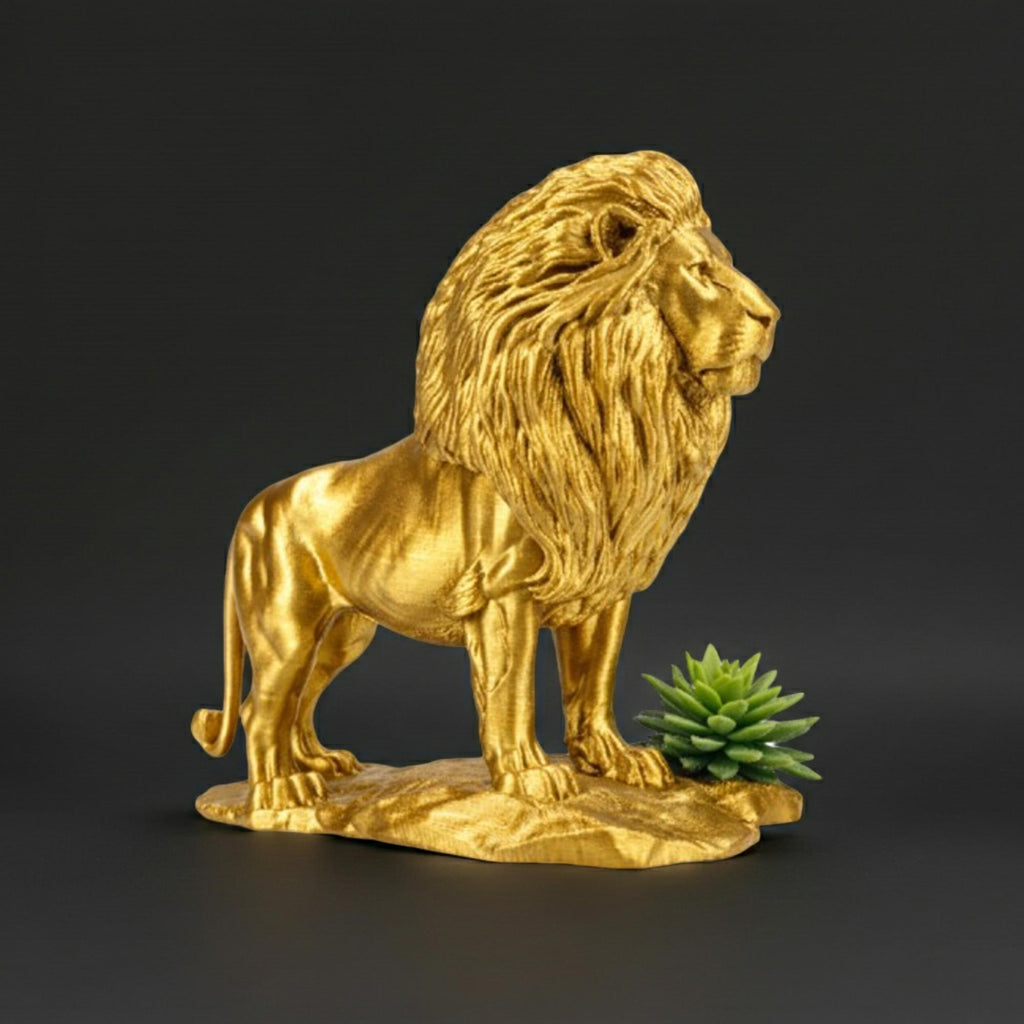 Gold Lion Statue on Rock in metallic PLA by MokshaGoldSculptures, 3D printed finish, next to green succulent.
